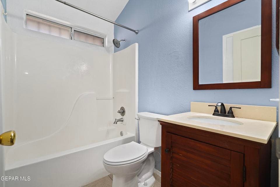 The second bathroom features a full bath with convenient access to secondary bedrooms. Its layout is practical and easy to maintain. Clean finishes add to its appeal. This bath serves both family and guests.